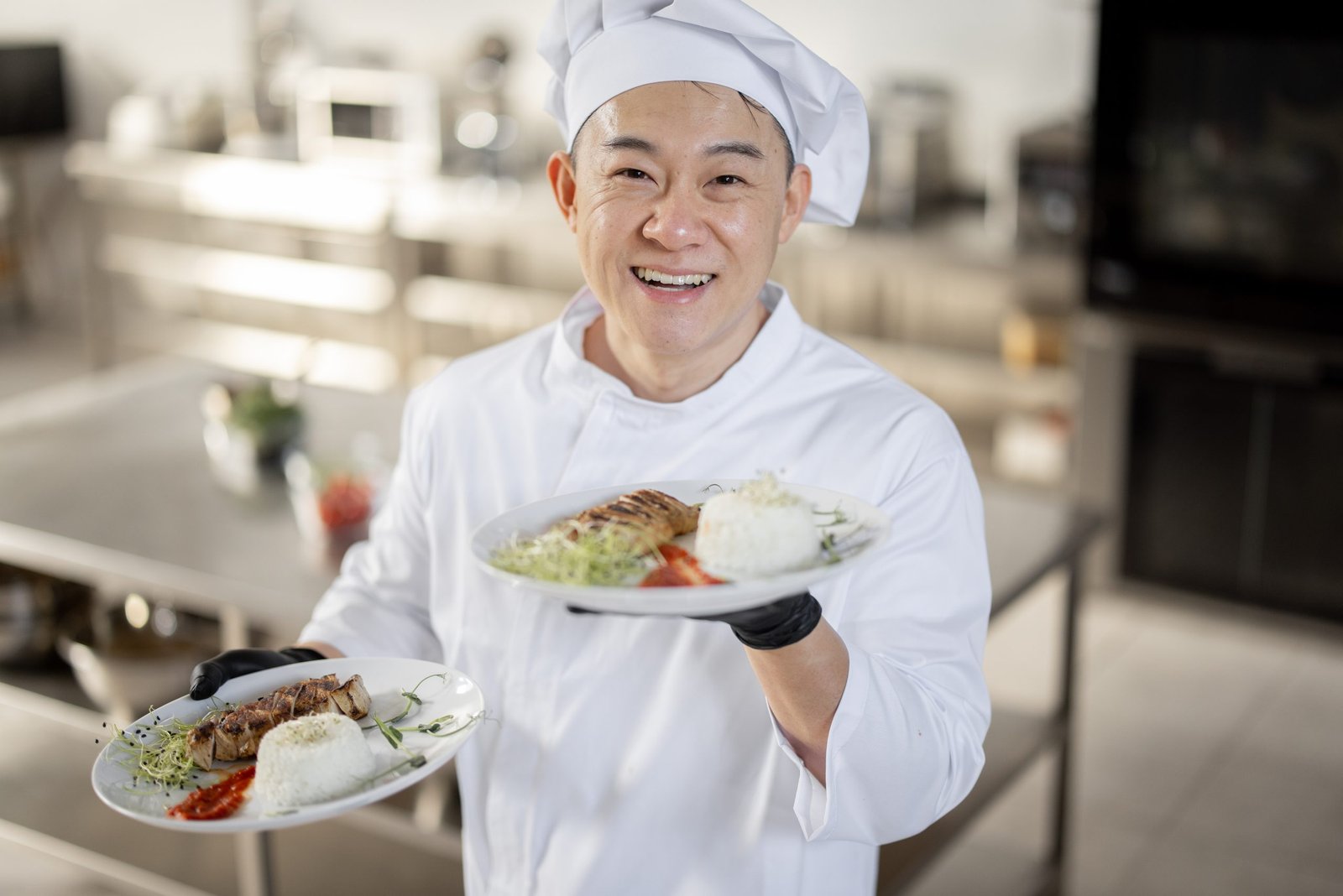 portrait-of-smiling-chef-in-uniform-standing-with-2023-11-27-04-55-41-utc-scaled